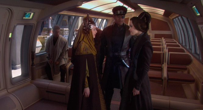 Dormé escorts Padmé to the front of the transport